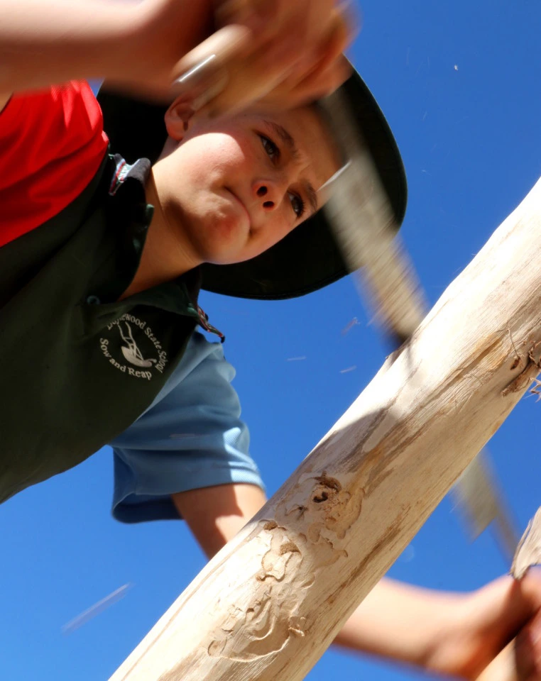 boy making a didgeridoo