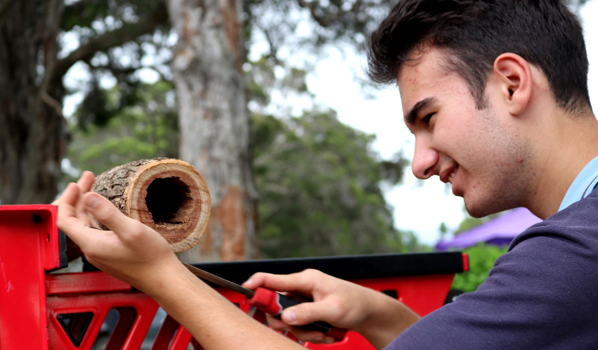 School students participating in a Didge in a Day workshop crafting their own didgeridoos